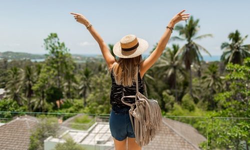 view-from-back-traveling-woman-straw-hat-enjoying-amazing-tropical-landscape
